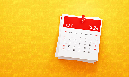 May 2024 calendar on yellow background. Front view. Horizontal composition with copy space. Calendar and reminder concept.