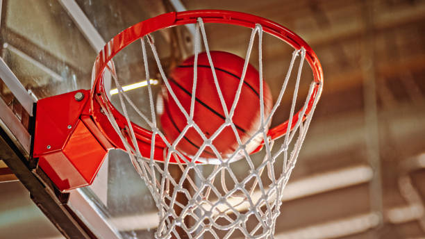 istock Basketball falling in basket 1783649195