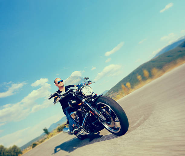 istock Biker riding a motorcycle on an open road 178365042