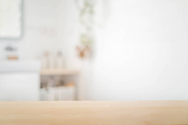 istock Bathroom empty tabletop wooden shelf for product display with blurred shower interior. Blurred background 1783651638