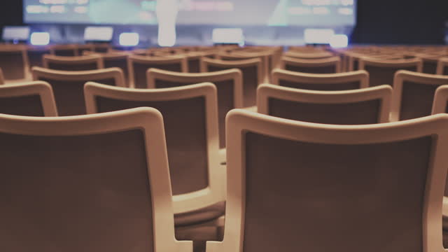 Empty chair in conference hall