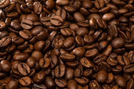 A close up panoramic shot of coffee beans. Soft focus.