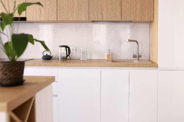 istock Scandinavian style cozy modern white kitchen interior with a dining zone, white modern interior in farmhouse style. nordic kitchen in loft apartment. 3D rendering 1783654689