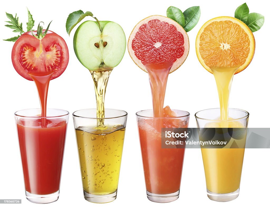 Juice flowing from fruits into the glass. Apple - Fruit Stock Photo