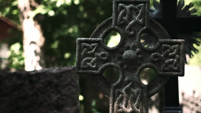 stone cross at a tomb