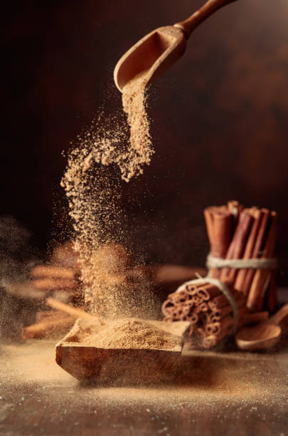istock Cinnamon powder is poured into a wooden bowl. 1783665157
