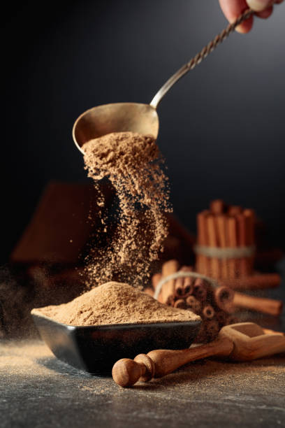 istock Cinnamon powder is poured into a black bowl. 1783665175