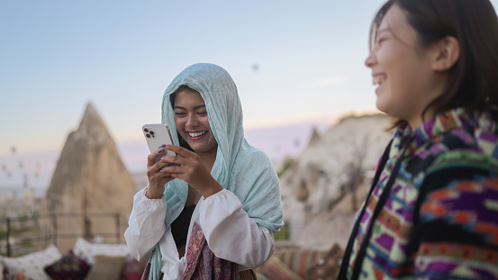 istock Two multi-racial female friends taking photos in Cappadocia 1783668359