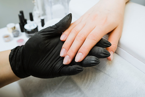 Closeup Of Beautiful Female Hands Having Manicure At Beauty Salon.