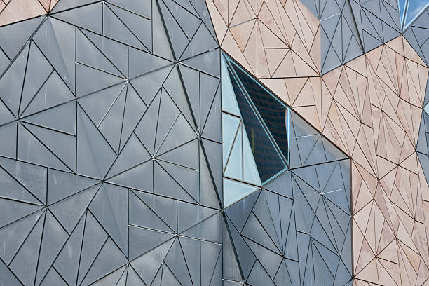 Building Facade Interesting pattern on the facade of a building at Federation Square, Melbourne, Australia interlocked stock pictures, royalty-free photos & images