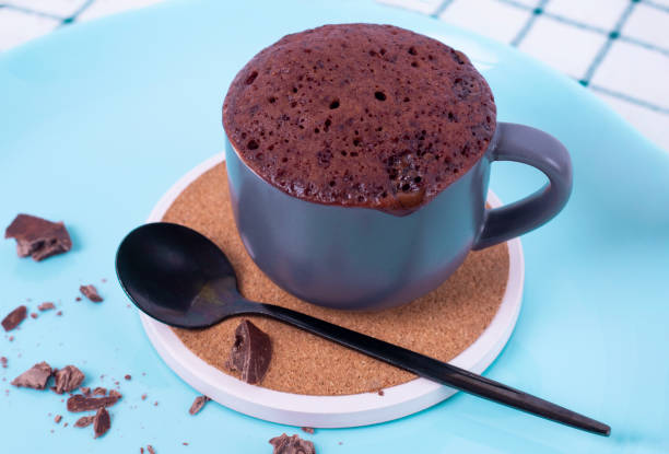 istock mugcake is microwaved. Homemade cupcake in a mug is on a plate. 1783677091