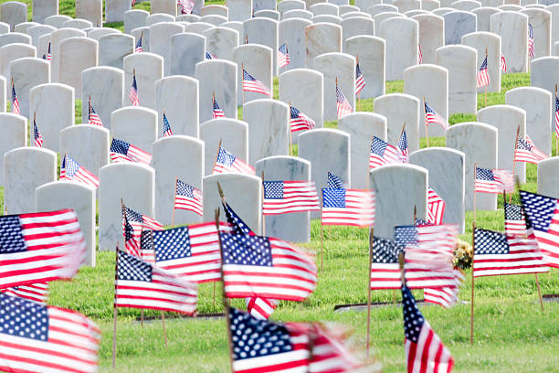 istock American Flags Fly in the Cemetery 178368663