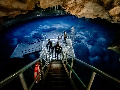 Underground blue hole in the sinkhole cavern at Devil's Den dive resort in Williston, Florida