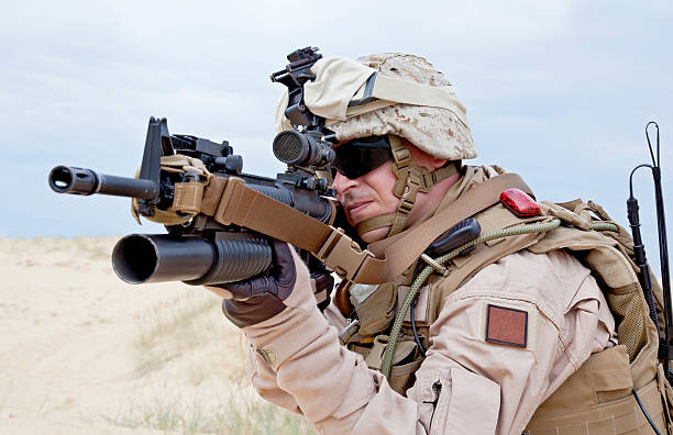istock Army man aiming a gun in the desert 178368862