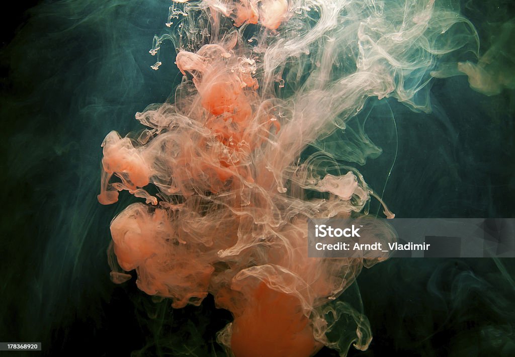 Red Ink in water. Red Ink in water on a black background.  Alchemy Stock Photo