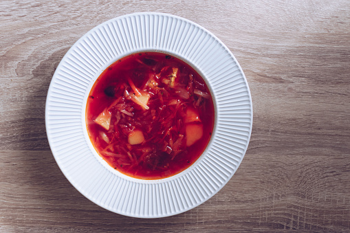 Traditional Ukrainian borscht. Plate of red beet root soup borsch. Traditional Ukraine food cuisine.