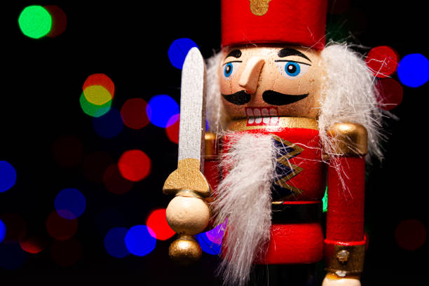 istock Christmas nutcracker wooden figure, toy soldier decoration with copy space and tree lights bokeh in background. 1783695004