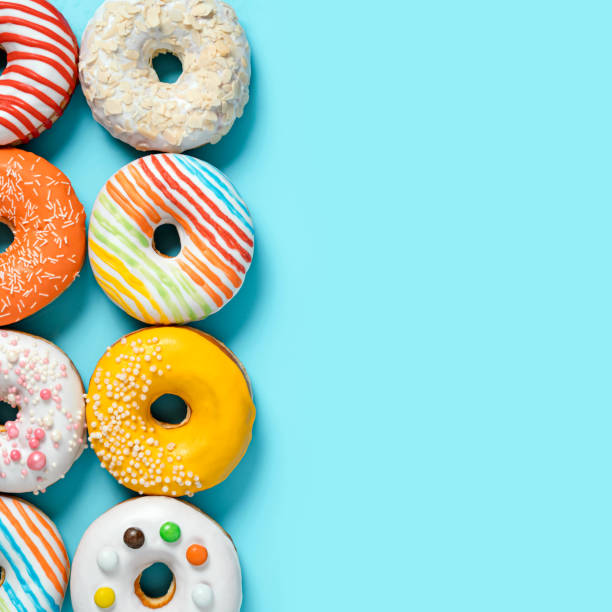 istock Glazed donuts on colorful background, top view 1783696904