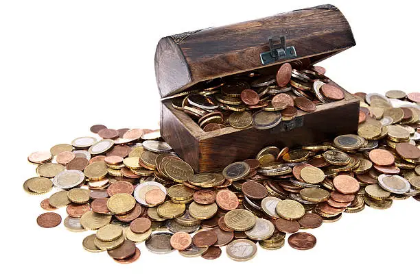 Wooden treasure box with Euro-Coins isolated on white background