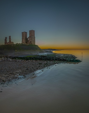 The view of Historic Reculver Towers at sunset. Kent, England