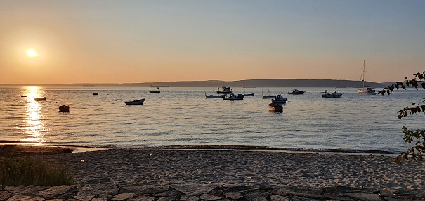 sunset at the harbor wall, small village, la reunion island.