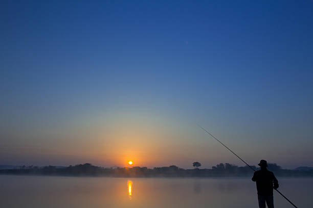 istock fishing in the sunrise 178370427