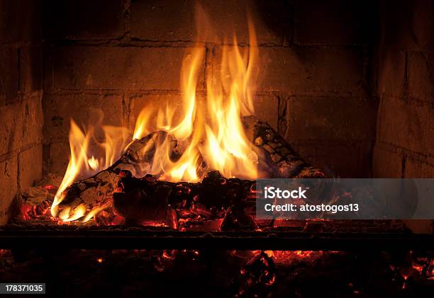 Yellow Flames In The Darkness Stock Photo - Download Image Now - Architectural Feature, Architecture, Ash