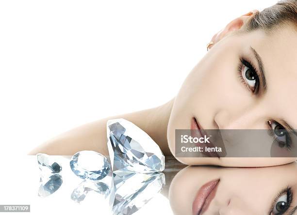 Woman With Elegant Makeup Resting Next To Shiny Diamonds Stock Photo - Download Image Now