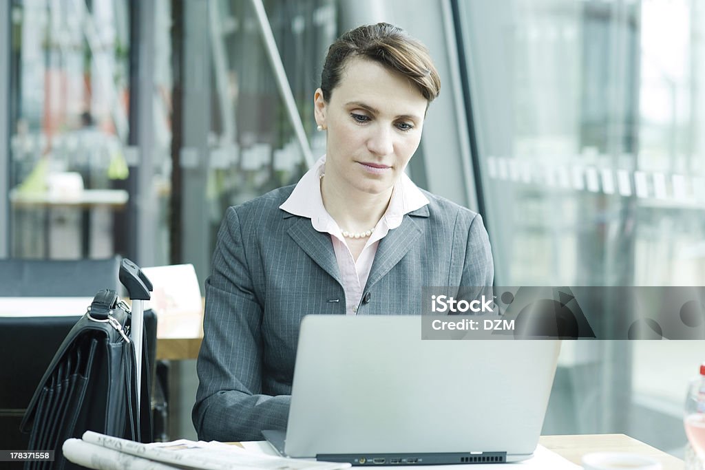 Business woman working Business woman working on notebook at the airport lounge Adult Stock Photo