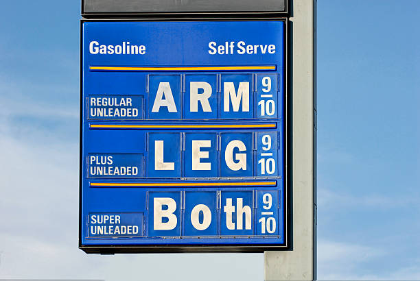 Gas Price Humor A gas sign with a humorous slant fuel pump photos stock pictures, royalty-free photos & images