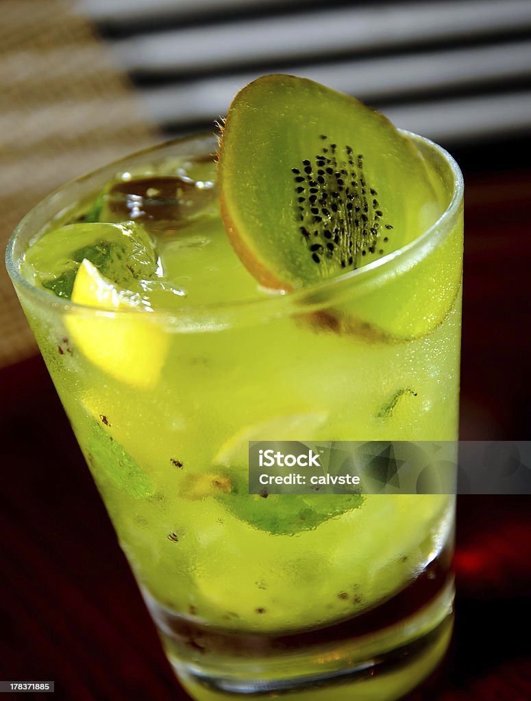 Kiwi mojito close up Kiwi mojito close up on the a wooden table Alcohol - Drink Stock Photo