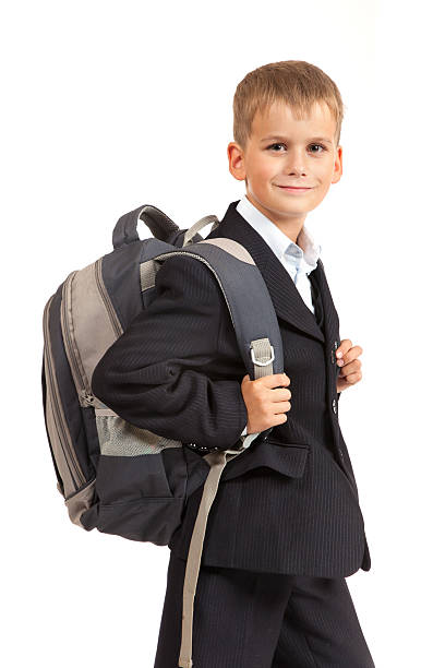 istock Schoolboy sitting on books. Back to school 178372872