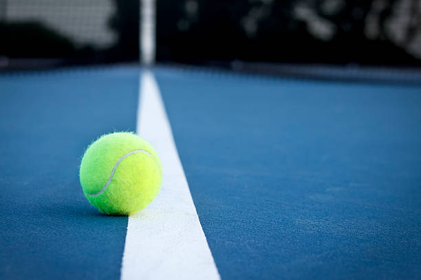 Tennis Ball on the Line stock photo