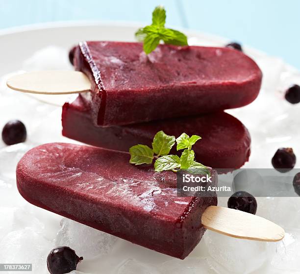 Three Dark Red Ice Pops With Garnish Stock Photo - Download Image Now - Backgrounds, Berry Fruit, Black Color