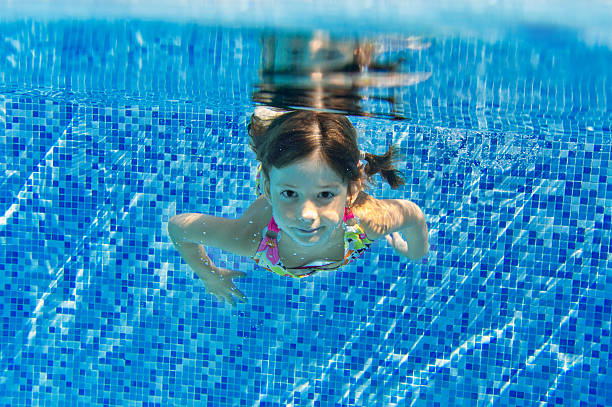 istock Happy smiling underwater child in swimming pool 178373715