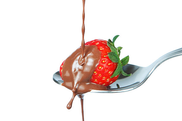istock The liquid chocolate is poured on strawberries. 178373779