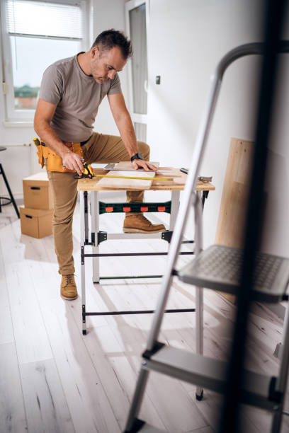 istock Professional carpenter at work measuring wooden planks 1783738127