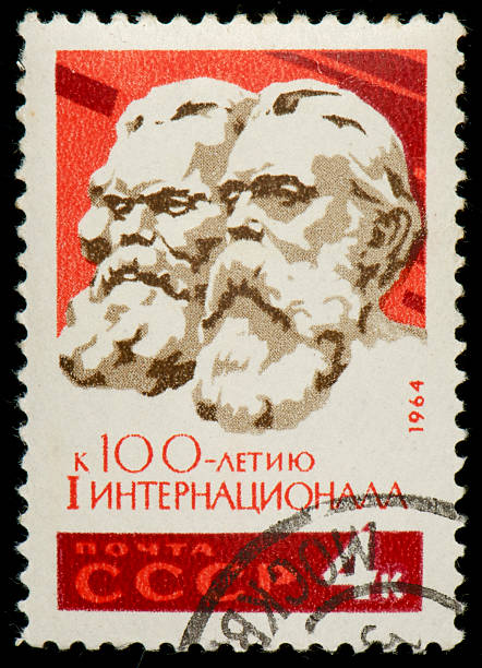 Soviet postage stamp with Marx and Engels Soviet postage stamp from 1964 released for the 100th anniversary of the International Workingmen's Association  friedrich engels stock pictures, royalty-free photos & images