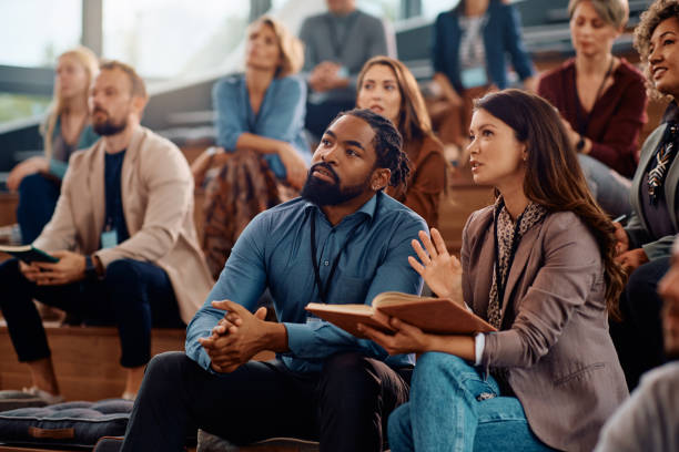 istock Business colleagues communicating during a seminar in conference hall. 1783743687