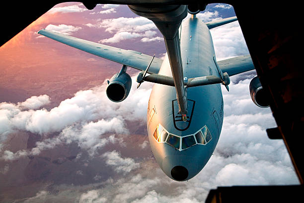 Passing Gas An Air Force KC-10 Extender receives fuel inflight from another KC-10. military tanker airplane photos stock pictures, royalty-free photos & images