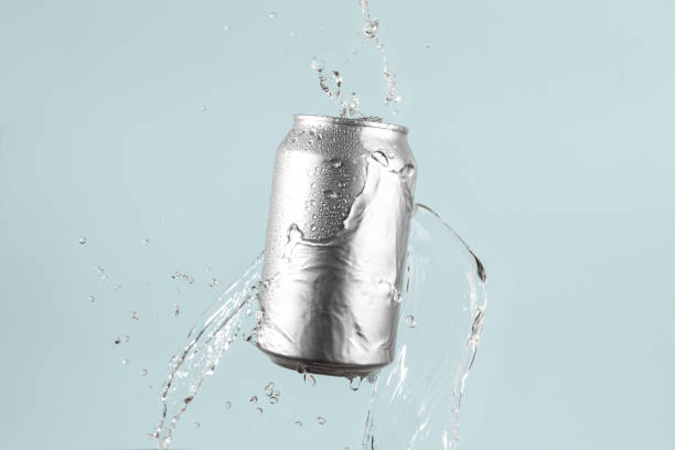 istock Aluminium beer or soda drinking can with water splash on light blue background 1783749047
