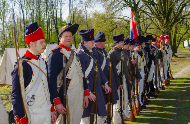 Copenhagen, Denmark - May 14, 2019: Female Royal Guard looking at her male companion. Photograph taken at Amalienborg Palace which is the Queen's residence.