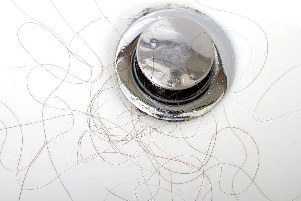 istock Hair Clogging The Drain 178375464