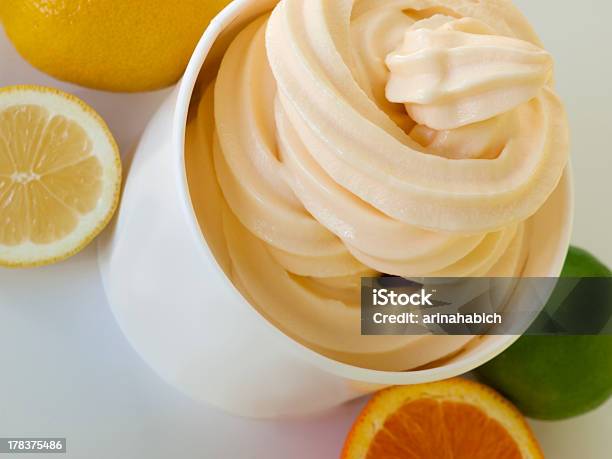 Frozen Soft Serve Yogurt Stock Photo - Download Image Now - Soft Serve Ice Cream, Cup, Yellow