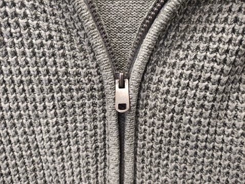 Zipper fastening on sweater, close-up