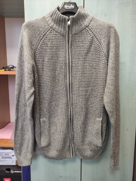 Men's sweater with zipper hanging on a hanger