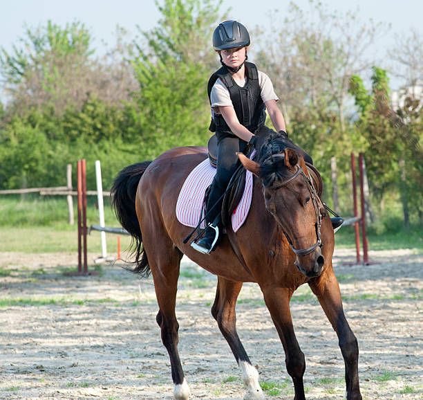istock girl riding a horse 178376211
