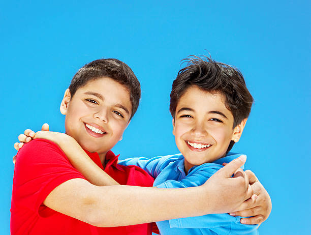 istock Happy cute boys over blue sky 178376585