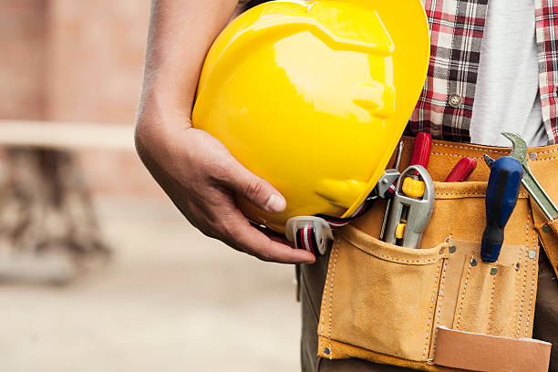 istock Close-up of hard hat holding by construction worker 178376664
