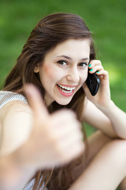 istock Young woman showing thumbs up 178377400